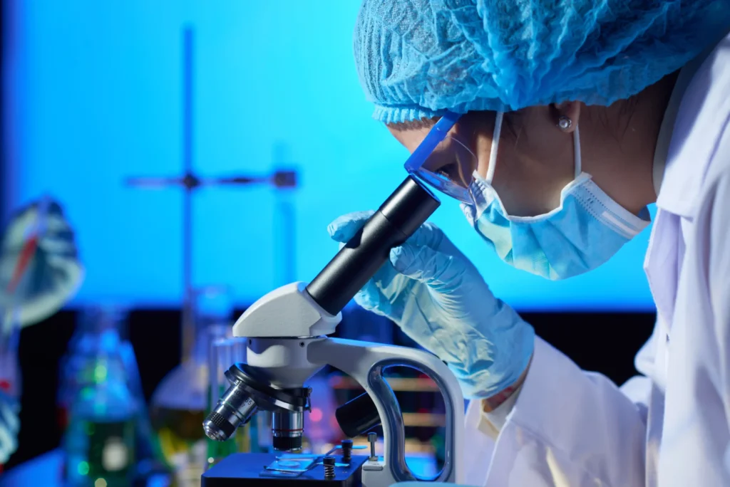 Industrial Chemical Consulting 6 examining sample with microscope 1 scaled 1