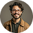 Industrial Chemical Consulting 21 Cheerful Curly Haired Man in Tortoiseshell Glasses